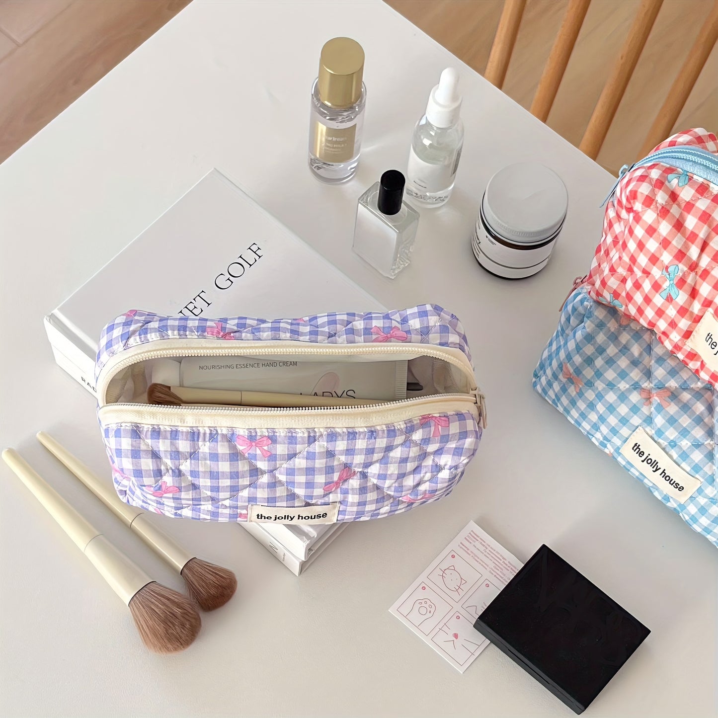 Polyester plaid pencil case with bowknot design for women and girls.