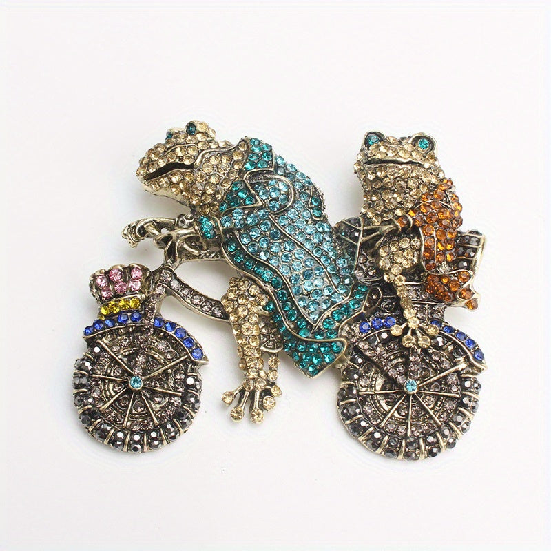 Vintage uslubidagi rhinestone brosh pin, ikki qurbaqa velosipedda, noyob hayvon dizayni aksessuar.