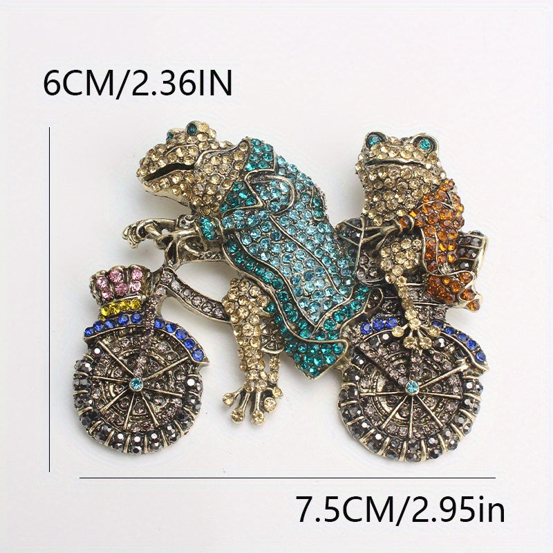 Vintage uslubidagi rhinestone brosh pin, ikki qurbaqa velosipedda, noyob hayvon dizayni aksessuar.