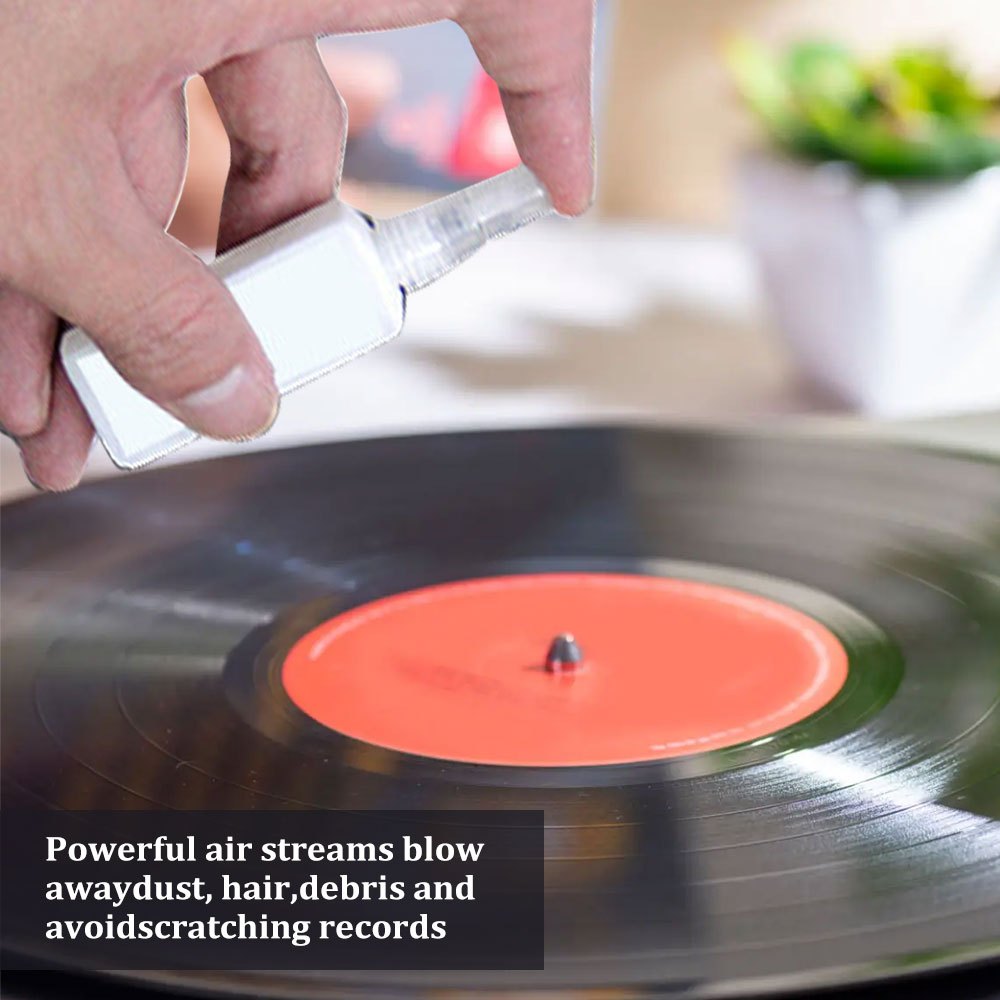 Vinyl record cleaning kit with anti-static plastic brush and cleaner for record players and gramophones. Made of uncharged, durable material.