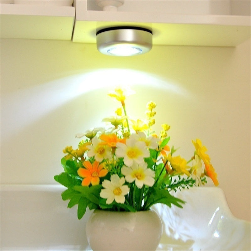 Touch light with 3 LEDs for cabinets and hallways, no batteries included.