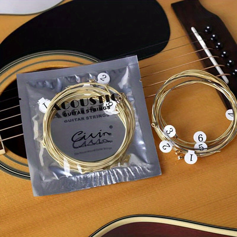 1 Set of 6 Goldbronze acoustic classical guitar strings with roundwound, coated, and polished finish for durability and warm tone.