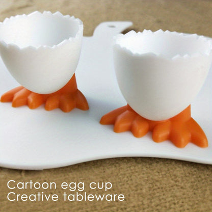 4 plastic egg cup holders with cartoon base design, perfect for boiled eggs. Durable, kid-friendly, and ideal for breakfast and parties.