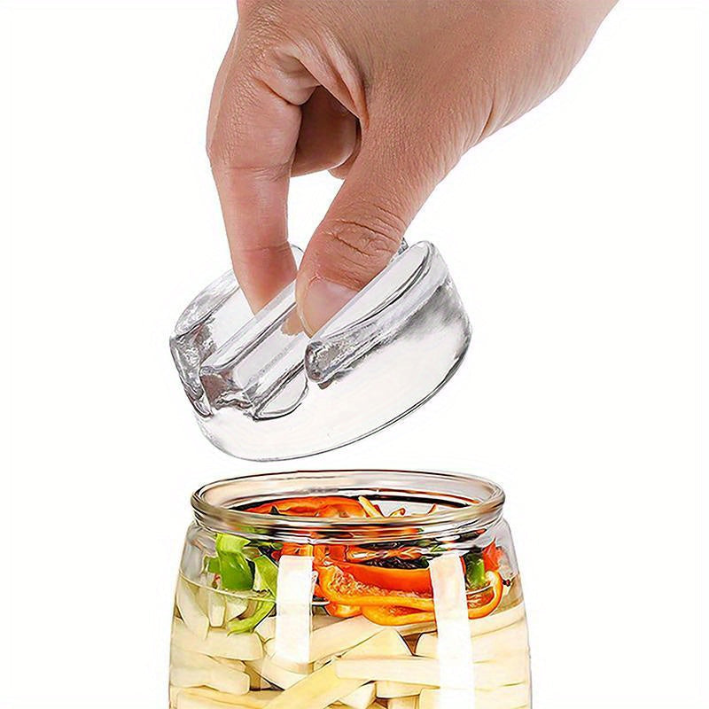 Glass fermentation weight lid for wide mouth Mason jars ensures the perfect fermentation of pickles, kimchi, and sour cucumbers. This easy-to-use kitchen gadget, a stone weight, is ideal for fermenting your favorite vegetables.