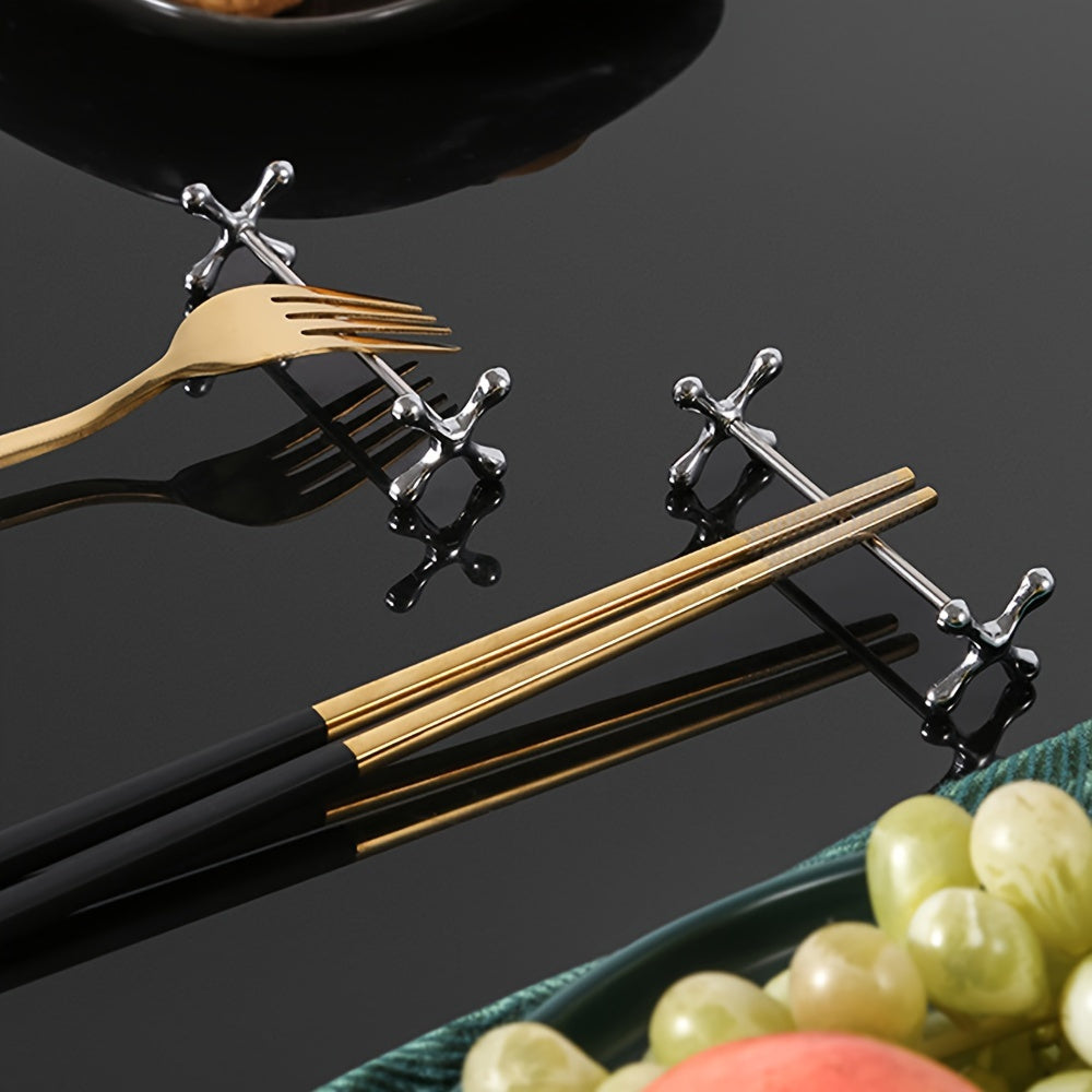 Metal chopstick rests that can also hold forks, spoons, and pens. Japanese-Korean style dining accessory in a set of 1.