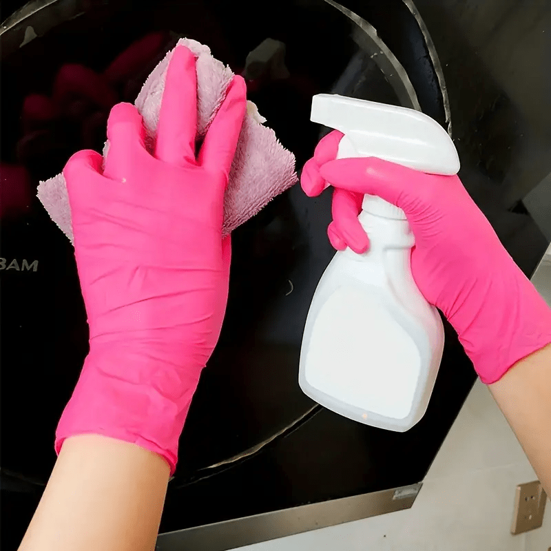 Pink disposable gloves, available in sets of 20, 80, or 150 pieces. These elastic and durable gloves are ideal for tattooing, manicures, kitchen washing, and other disposable apparel needs.