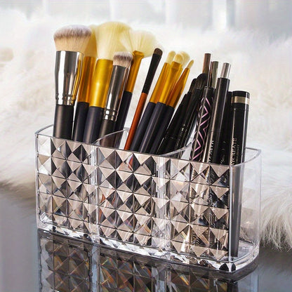 Stylish acrylic makeup brush holder with diamond pattern design and three compartments for pens, eyebrow pencils, and lipstick. Perfect for home organization.