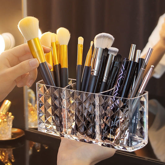 Stylish acrylic makeup brush holder with diamond pattern design and three compartments for pens, eyebrow pencils, and lipstick. Perfect for home organization.