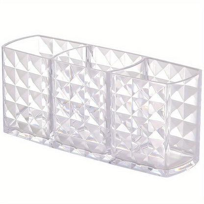 Stylish acrylic makeup brush holder with diamond pattern design and three compartments for pens, eyebrow pencils, and lipstick. Perfect for home organization.