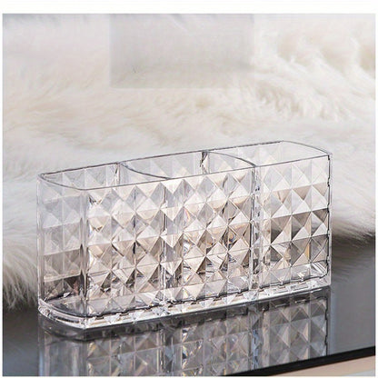 Stylish acrylic makeup brush holder with diamond pattern design and three compartments for pens, eyebrow pencils, and lipstick. Perfect for home organization.