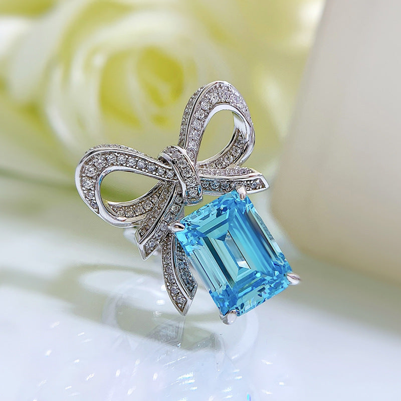 New for 2024, this stunning butterfly ring features a 9*12 aquamarine stone set in high carbon silver. Perfect for a female recipient, this ring comes in a random gift box style.