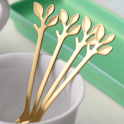 Set of 20 elegant stainless steel mini forks and coffee spoons with a golden leaf design. These utensils are durable, rust-resistant, and easy to clean, making them perfect for serving appetizers and desserts. Ideal for use at home, parties, and weddings.