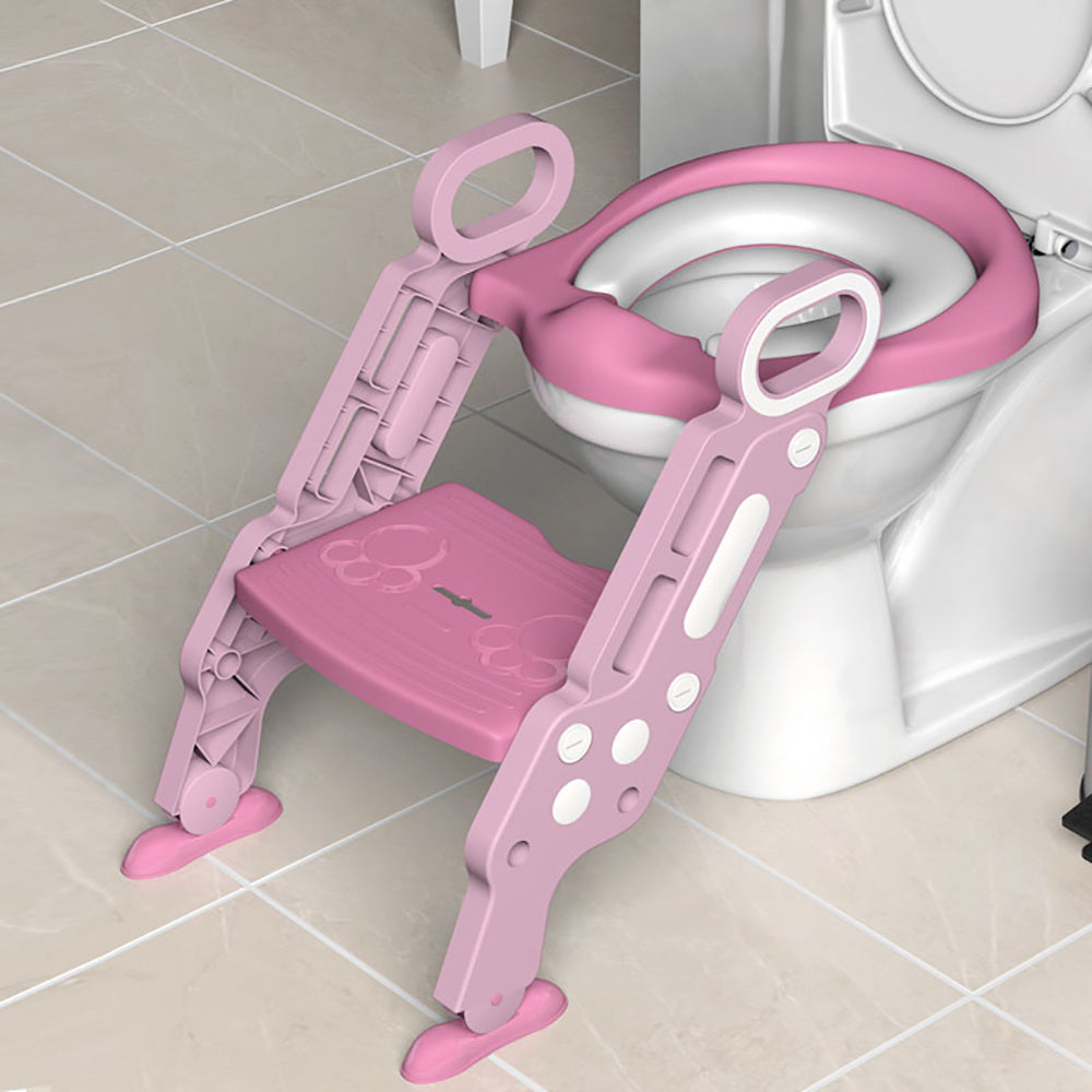 A folding staircase-type children's toilet seat with an auxiliary stool cushion for a baby girl or baby boy in the household restroom.