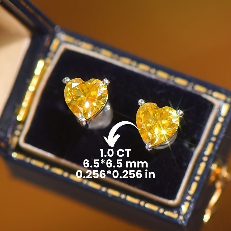 Celebrate Valentine's Day with these stunning 1ct heart-shaped yellow Moissanite stud earrings! Made of 925 sterling silver with vintage sexy styling, these earrings are perfect for all seasons, daily wear, and music festivals. The silver Moissanite