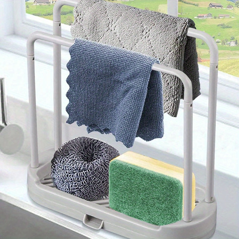 The "Grey Kitchen Sink Organizer" is a rust-proof countertop storage solution for sponges, dish cloths, and scrubbers.