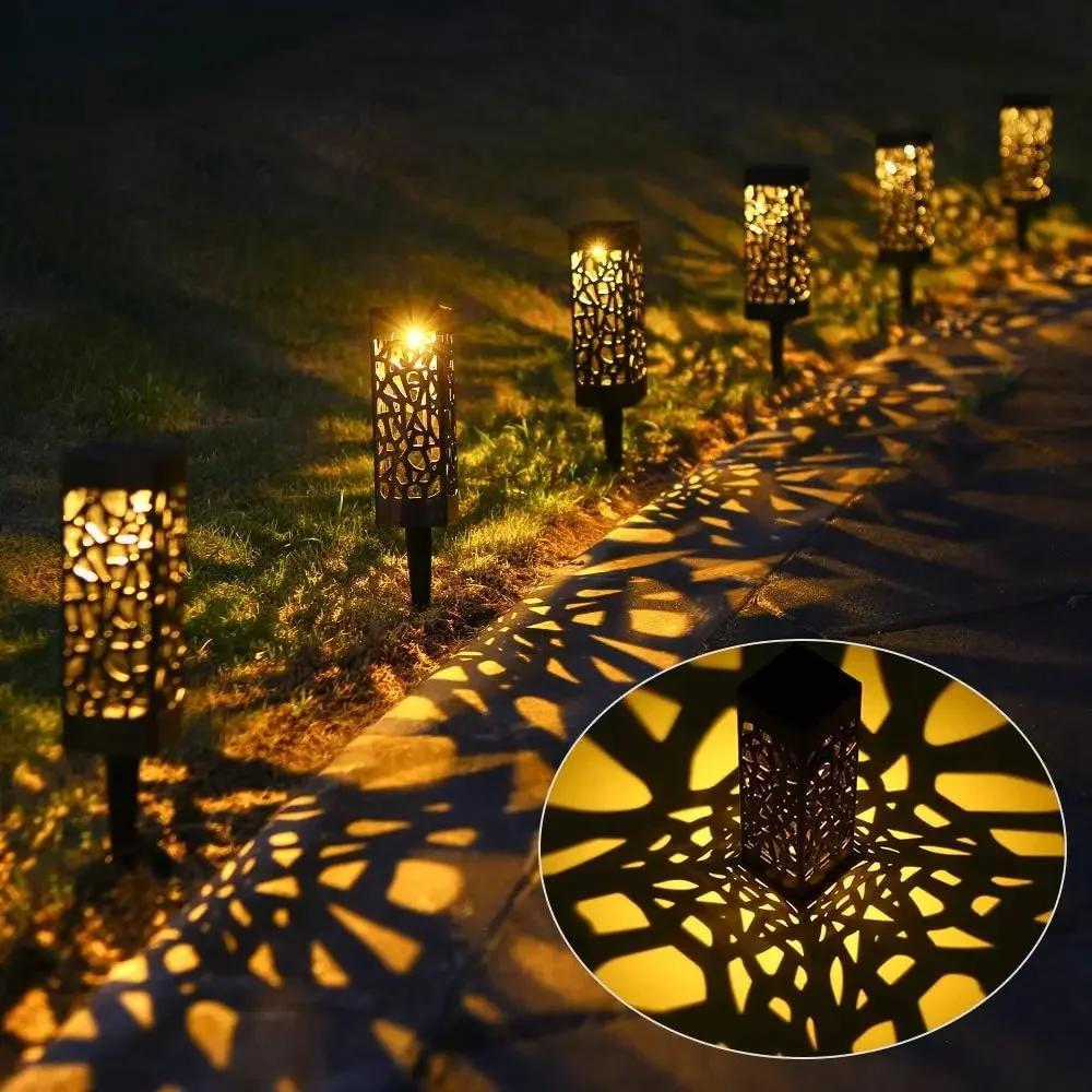 6-Pack Solar Path Lights with LED landscape lighting. Low-voltage, solar-powered with detachable fixture. Plastic lamp shade and solar battery included. ≤100 Lumen output.