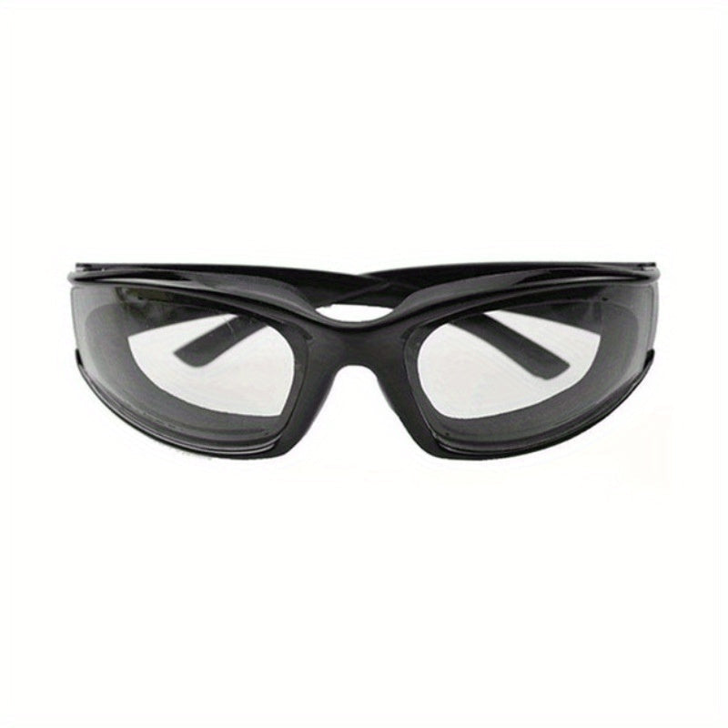 Kitchen Onion Cutting Goggles designed to protect eyes during chopping, made from anti-spicy material and splash-proof coating. Suitable for use in the kitchen to guard against eye irritation. Crafted from food-grade plastic for safety.