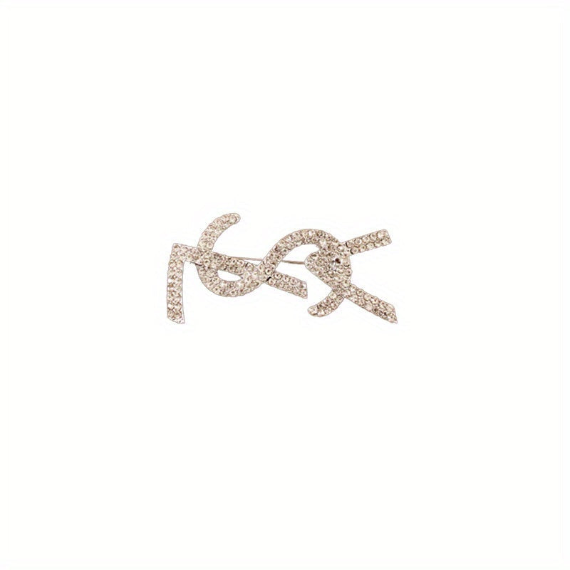 Elevate your look with this chic and sophisticated French-inspired alphabet brooch featuring stunning diamonds, perfect for women who want to add a touch of elegance and luxury to their outfits. Ideal for enhancing the sophisticated and high-end appeal