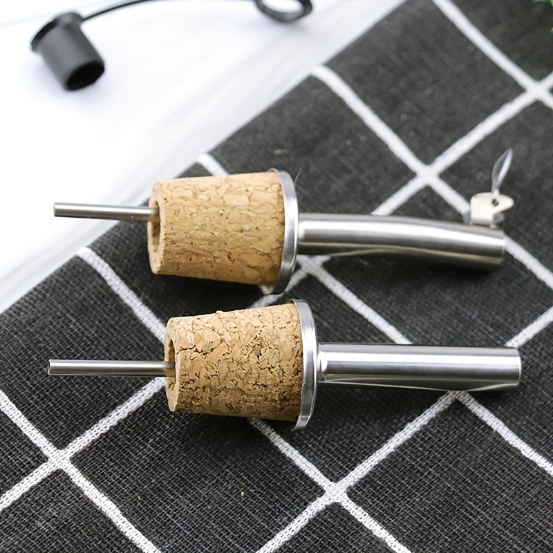 Set of 4 stainless steel pourers for wine, liquor, olive oil, and syrup bottles with cork stoppers.