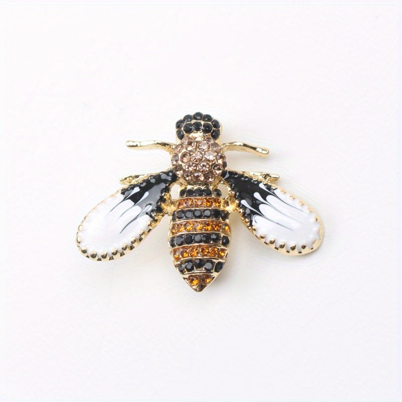 Charming and whimsical, this elegant and cute bee brooch pin features sparkling rhinestones. A delightful insect lapel accessory for women, it makes the perfect gift idea.