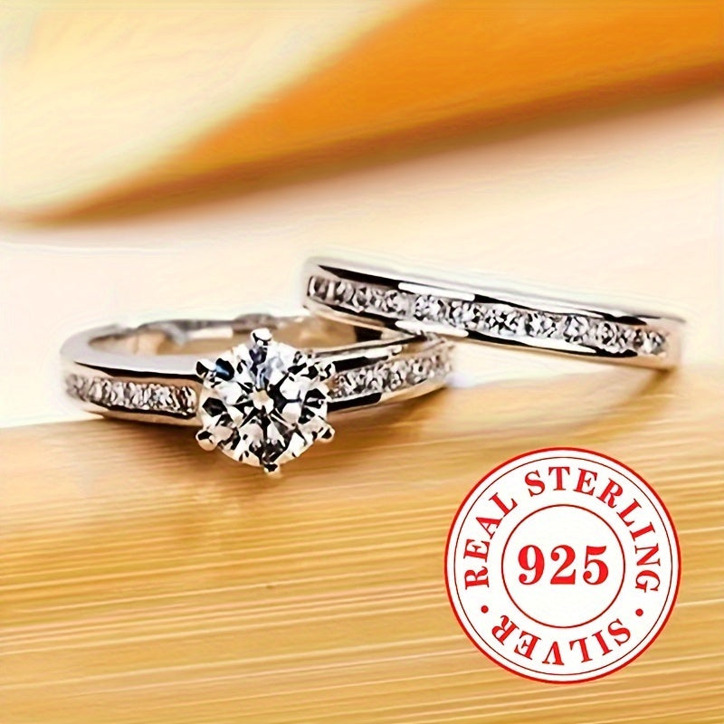 A pair of stylish ladies' rings, crafted from 5.7 grams of 925 sterling silver. These classic rings feature a single stone zirconia set in a 6-prong setting, perfect for engagement, wedding, and special occasions. Makes a great jewelry gift.