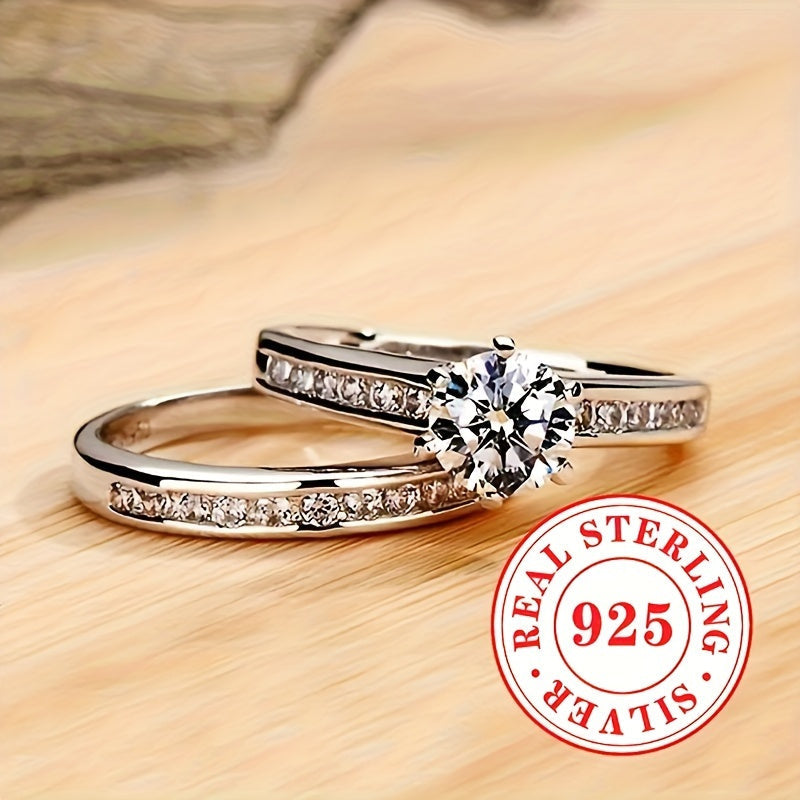 A pair of stylish ladies' rings, crafted from 5.7 grams of 925 sterling silver. These classic rings feature a single stone zirconia set in a 6-prong setting, perfect for engagement, wedding, and special occasions. Makes a great jewelry gift.