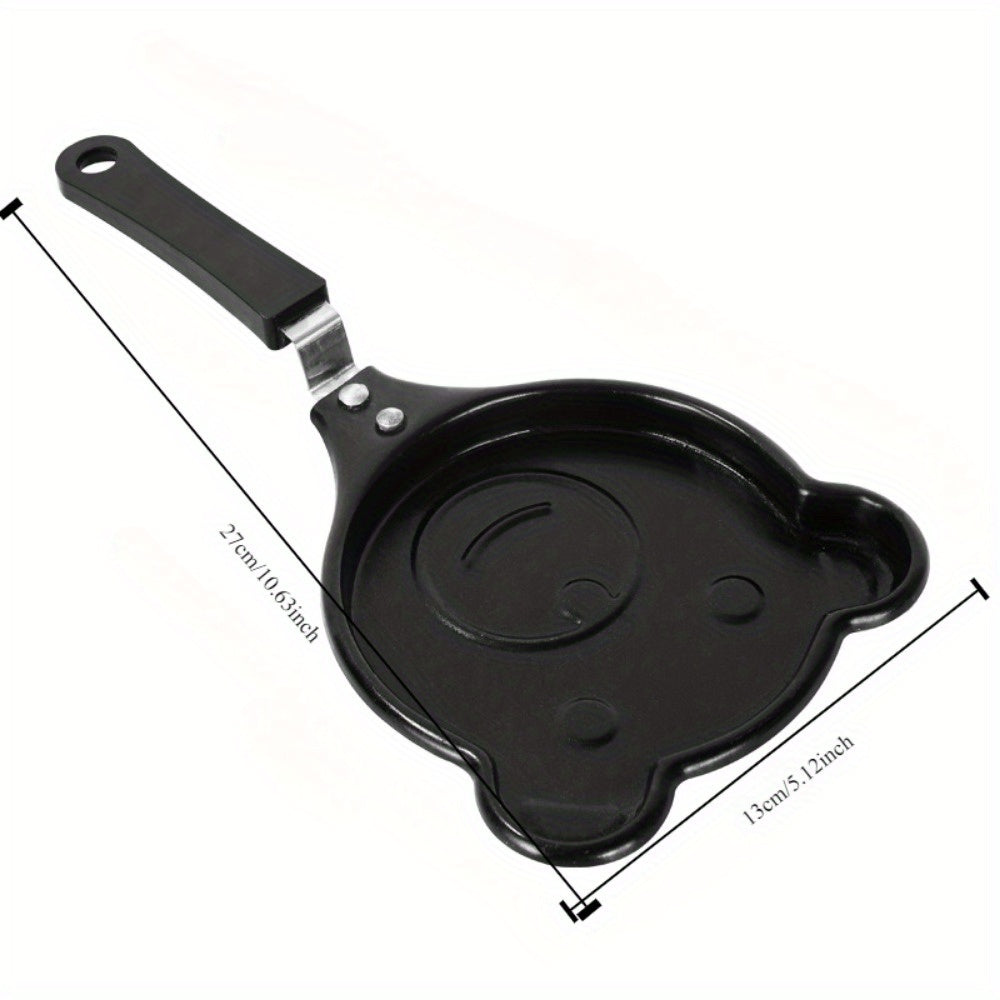 Bear-shaped omelet pan made of cast iron, with non-stick coating and a sturdy handle. This breakfast cookware is dishwasher safe and also doubles as a pancake and steak griddle in the kitchen.