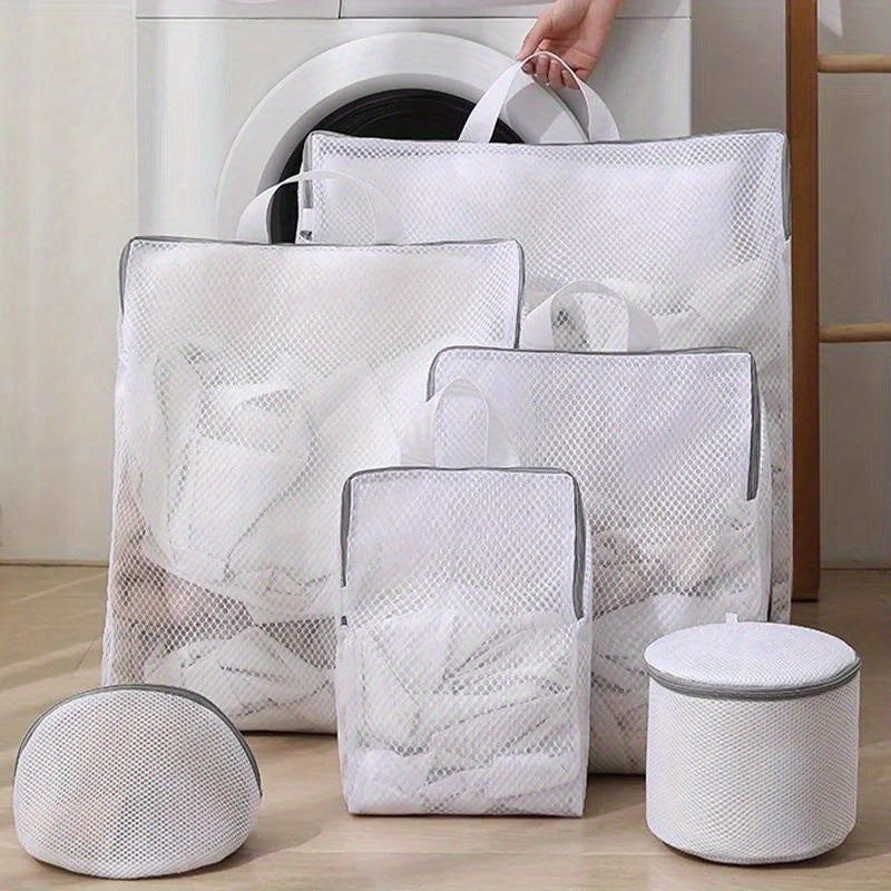 Set of durable polyester mesh laundry bags with zipper for washing machine, perfect for washing delicates such as bras, socks, and lingerie. These woven apparel wash bags are reusable and great for clothing care and laundry storage.