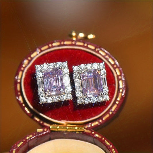 3.5 grams of 2 carat Purple Moissanite Square Earrings, set in 925 Sterling Silver. These elegant Emerald Cut Moissanite Earrings are the perfect choice for sophisticated women. Ideal for dates or as a special gift for her.