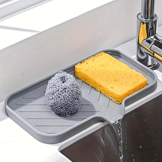 Silicone drain pad collects sink water, guards against faucet splashes. Perfect for kitchen or restaurant use.