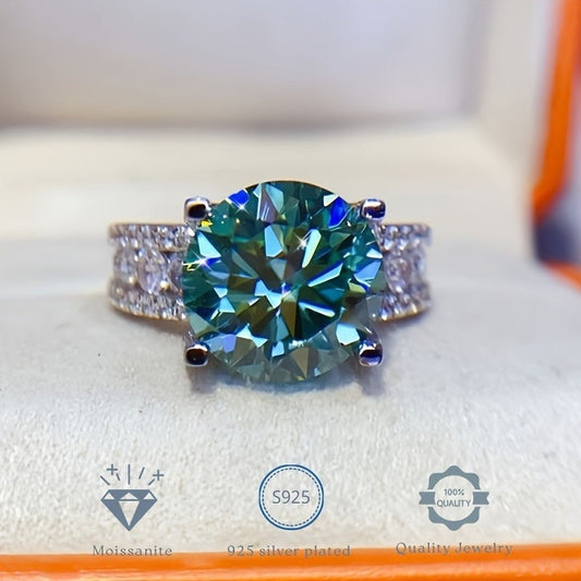 Moissanite Ring with 1 piece stone, 3/5/10 carats, set in 925 Sterling Silver with 18K Golden Plating. Features a 4-prong setting in a beautiful blue-green color. This elegant ring is perfect for vacations, proposals, music festivals, and sports.