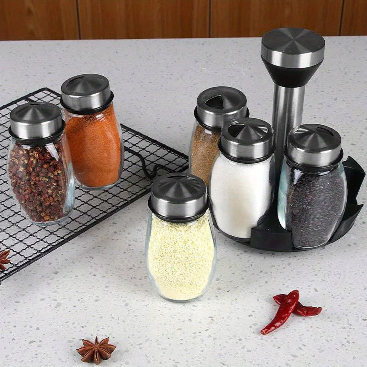 1 Set 7-piece Glass Spice Set with Rotating feature for easy installation. Made of glass, includes salt and pepper shakers. Great for kitchen storage.