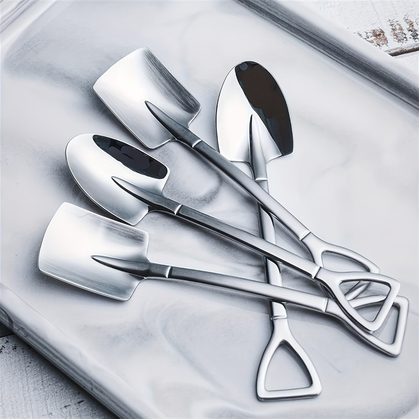 Four stainless steel spade spoons for creative desserts, fruit ice cream, and outdoor cooking.