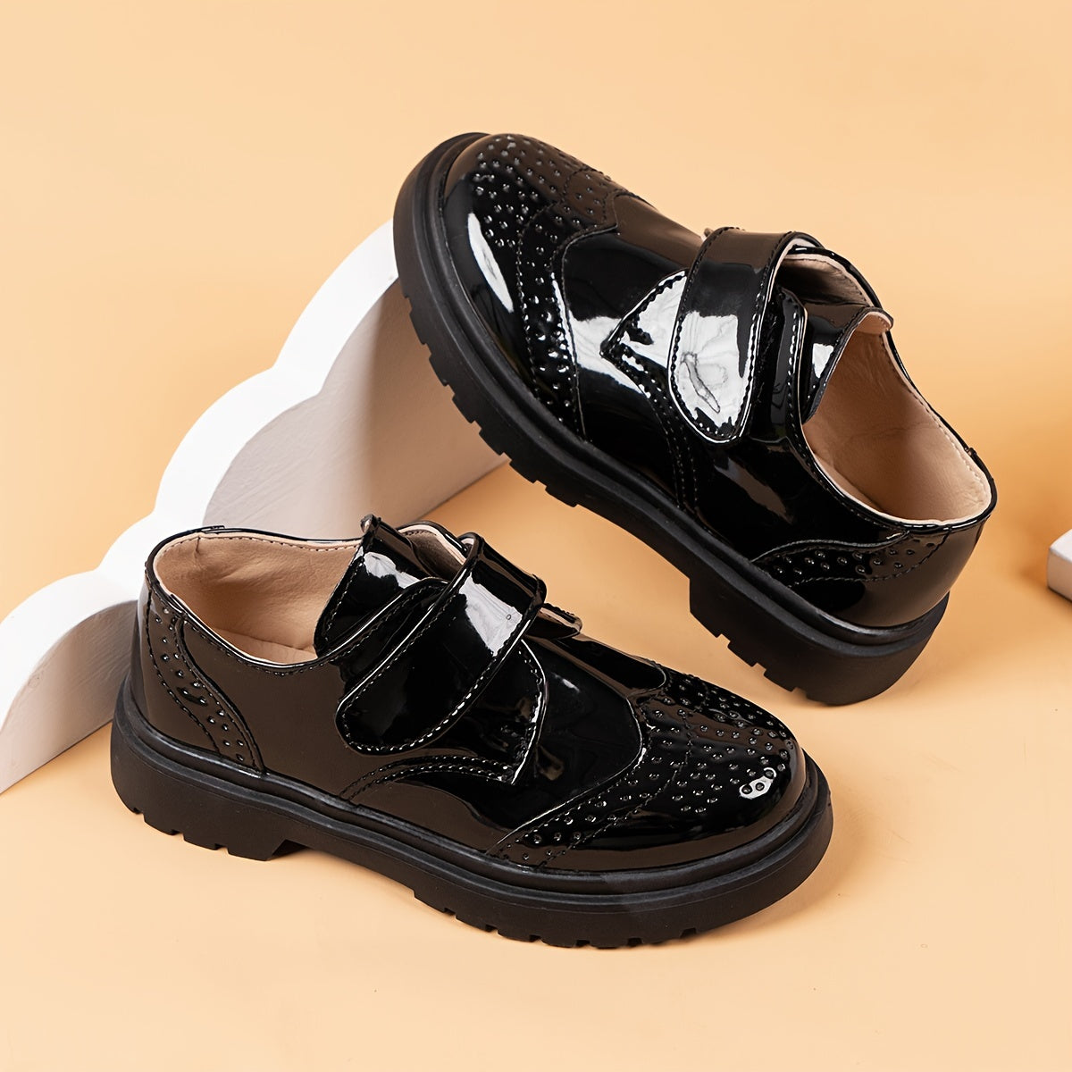 Breathable loafers for boys in shiny black PU with hook-and-loop closure, suitable for weddings, parties, and casual wear. Lightweight and comfortable for all seasons.