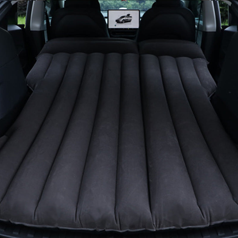 Portable car air mattress for road trips and camping, made of durable PVC material, fits in trunk as sleeping pad.