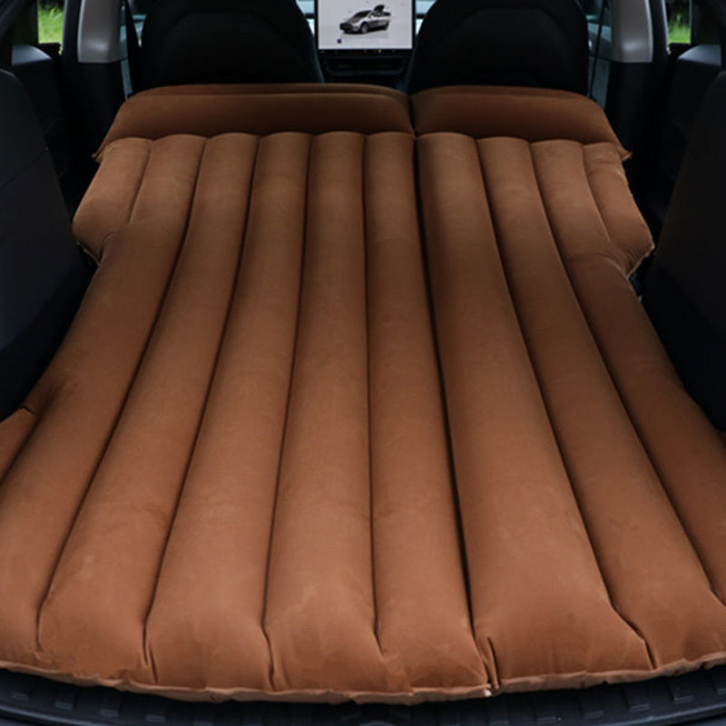 Portable car air mattress for road trips and camping, made of durable PVC material, fits in trunk as sleeping pad.