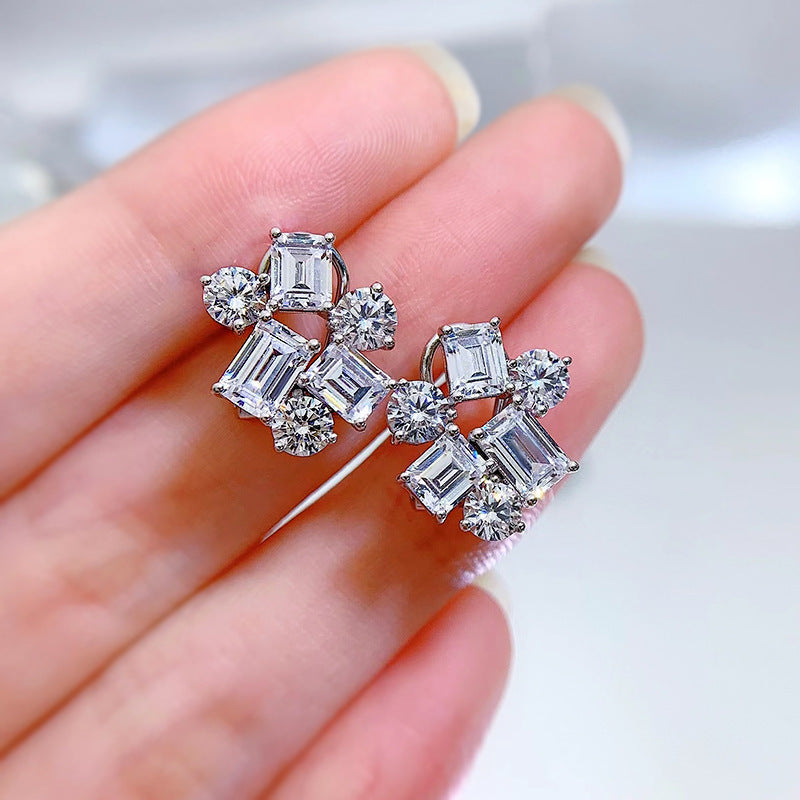 Included in the Christmas gift box are 925 sterling silver stud earrings featuring synthetic gemstones in a cluster design. These luxury and elegant earrings have no plating and are perfect for a holiday theme. The ear needle material makes them ideal