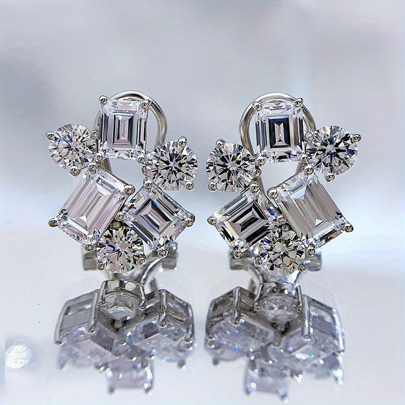 Included in the Christmas gift box are 925 sterling silver stud earrings featuring synthetic gemstones in a cluster design. These luxury and elegant earrings have no plating and are perfect for a holiday theme. The ear needle material makes them ideal