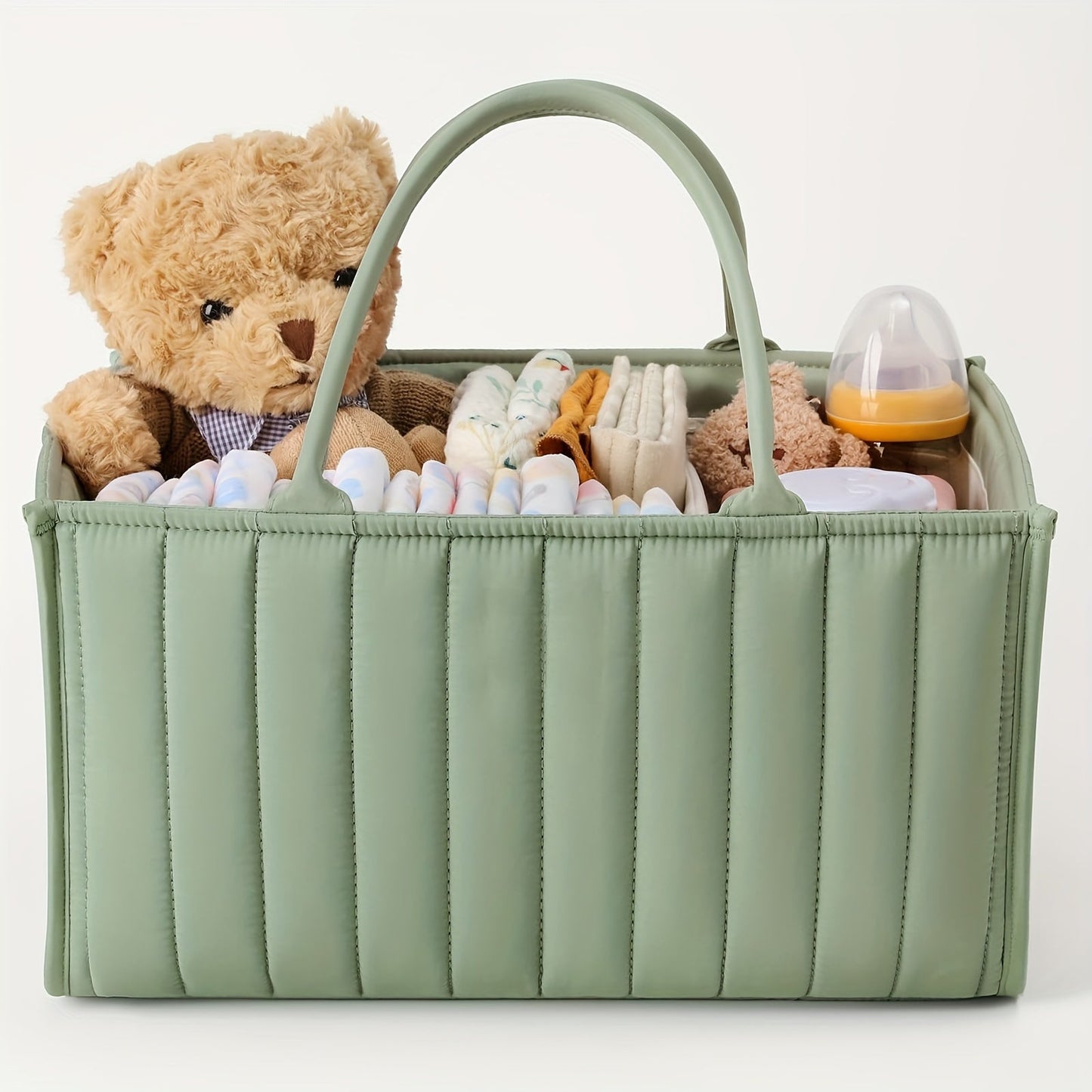 Portable nursery storage basket with handle made of polyamide, designed to organize diapers conveniently. This caddy is essential for keeping diapers, clothes, and toys in order. Perfect as a shower gift or registry item for new parents.