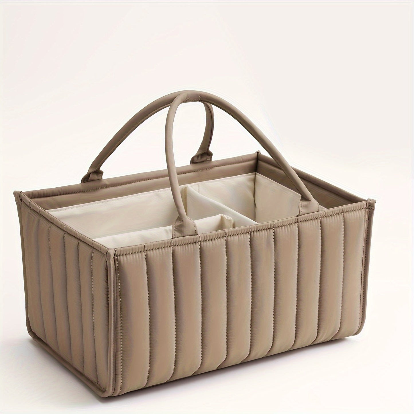 Portable nursery storage basket with handle made of polyamide, designed to organize diapers conveniently. This caddy is essential for keeping diapers, clothes, and toys in order. Perfect as a shower gift or registry item for new parents.