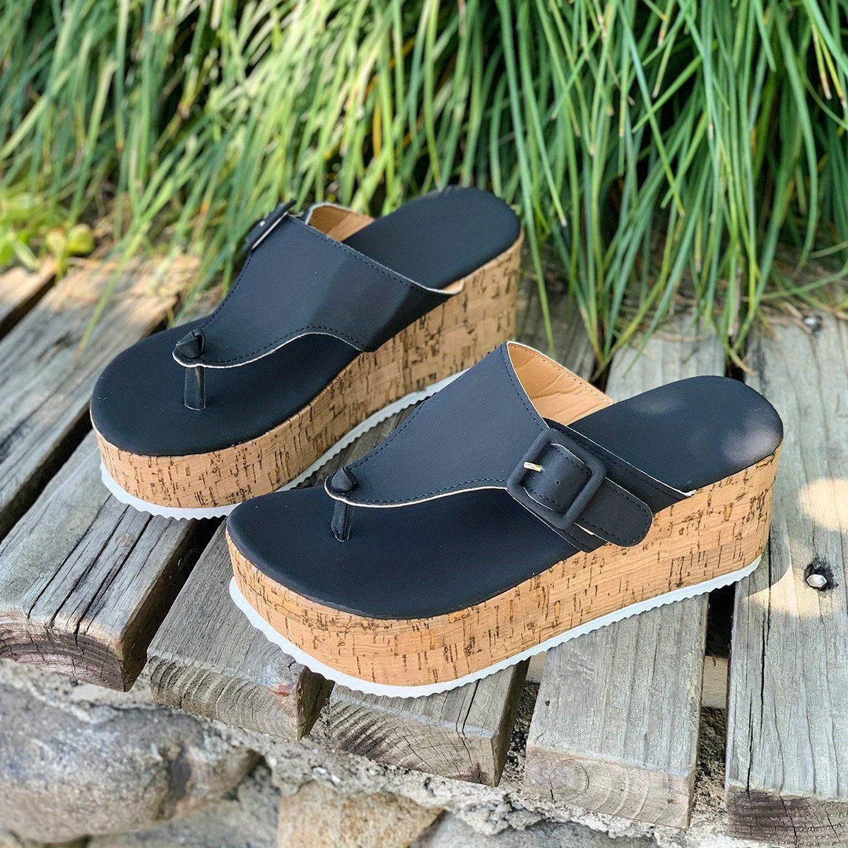 Women's platform flip flops with buckle strap, thick sole and PU sole.