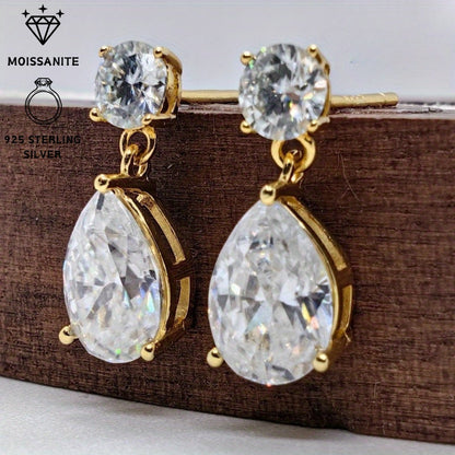 These stunning Vintage Teardrop Moissanite Drop Earrings exude elegance and charm. Crafted from 925 Sterling Silver and plated with 18K gold, each earring features a dazzling 2.5 carat moissanite stone. Perfect for both special occasions and everyday