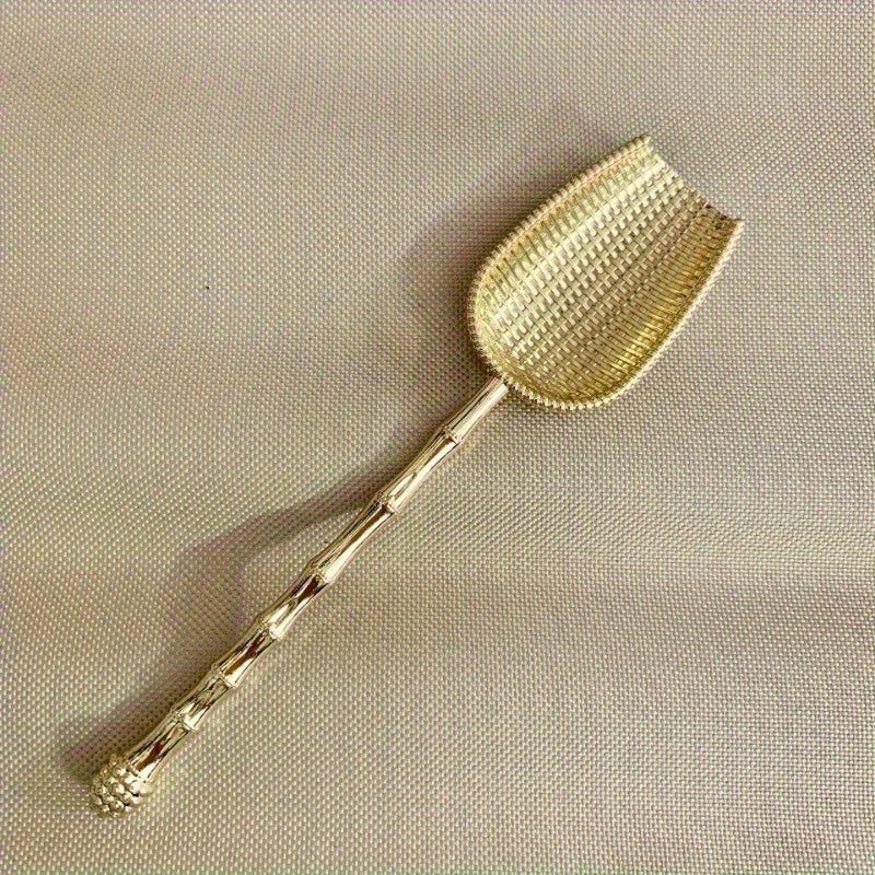 Elegant vintage metal tea scoop for loose leaf teas, coffee, and spices with long handle. Perfect for home kitchen use.