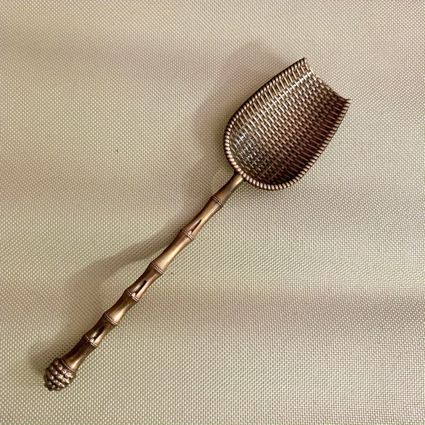 Elegant vintage metal tea scoop for loose leaf teas, coffee, and spices with long handle. Perfect for home kitchen use.