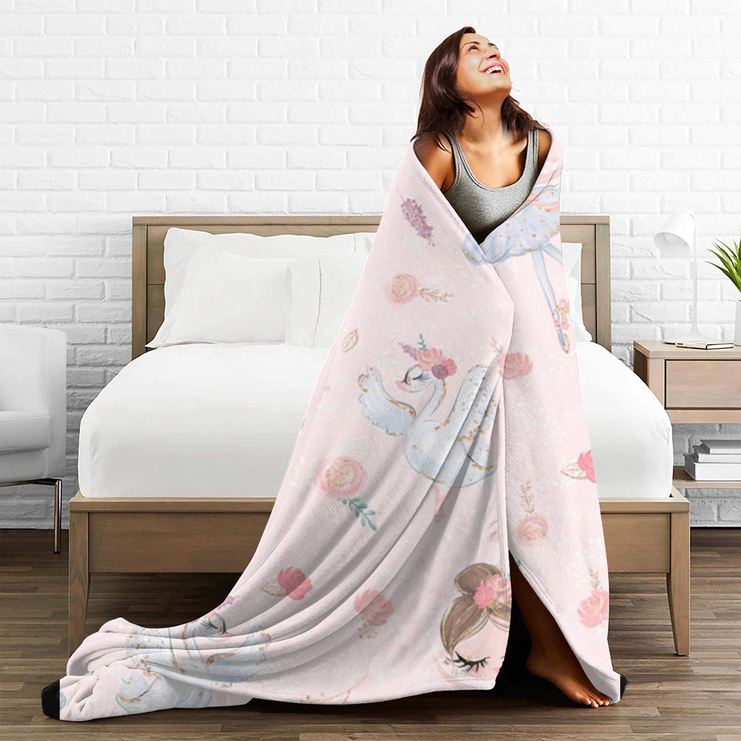 Soft and comfortable, this adorable pink blanket features a ballet dancer pattern on a velvet printed background. It is versatile enough to use as a nap blanket or small throw, making it the perfect birthday gift for anyone who appreciates creative