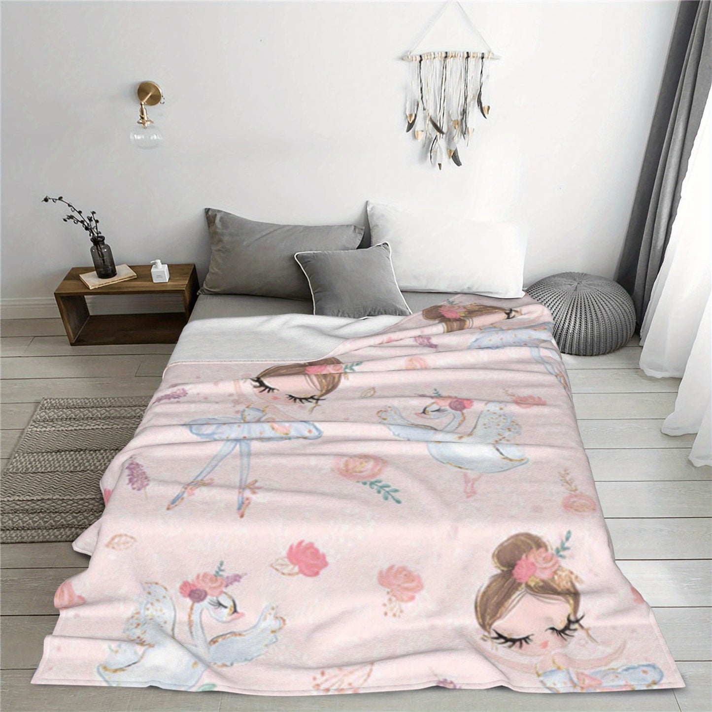 Soft and comfortable, this adorable pink blanket features a ballet dancer pattern on a velvet printed background. It is versatile enough to use as a nap blanket or small throw, making it the perfect birthday gift for anyone who appreciates creative