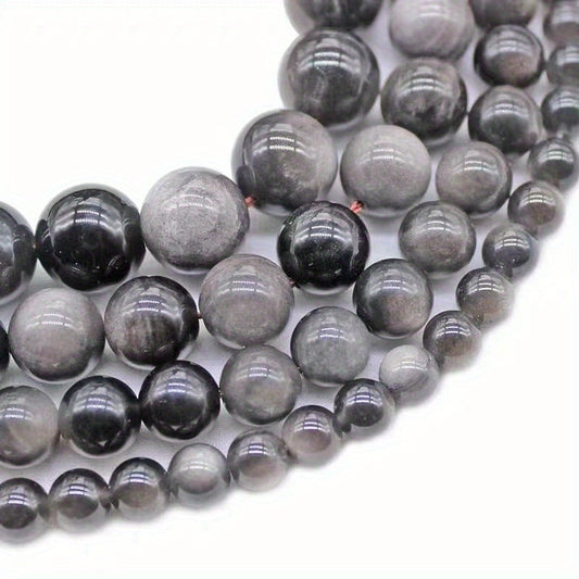 XULIN offers a set of 6/8/10mm Natural Stone 7A Silvery Obsidian Beads, perfect for DIY jewelry making. These lustrous round faux gemstones can be used to create beautiful necklaces, bracelets, and earrings. Ideal for crafting fashionable and romantic