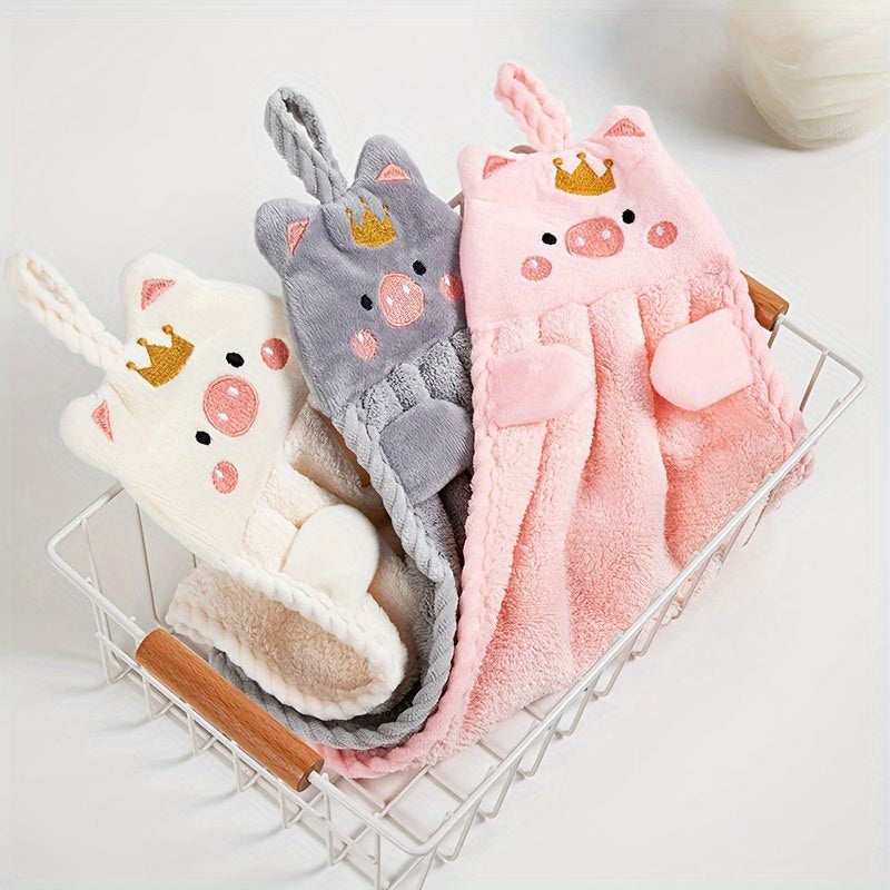 Adorable pig-themed microfiber hand towel in pink, light pink, or gray. Ultra absorbent and soft with hanging loop. Ideal for home use. Quick-drying for kitchen or bathroom.