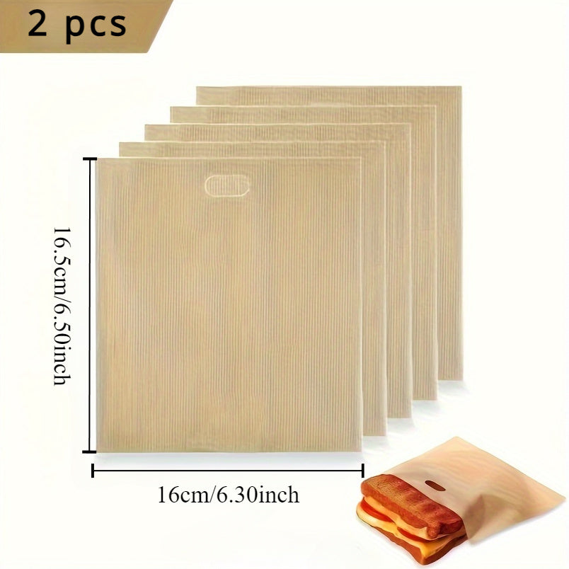 2 pieces of reusable fiberglass toaster bags with non-stick coating, measuring 16.0x16.51cm, perfect for making grilled cheese sandwiches, pizza paninis, and garlic bread. These bags are compatible with toasters, microwaves, and grills.