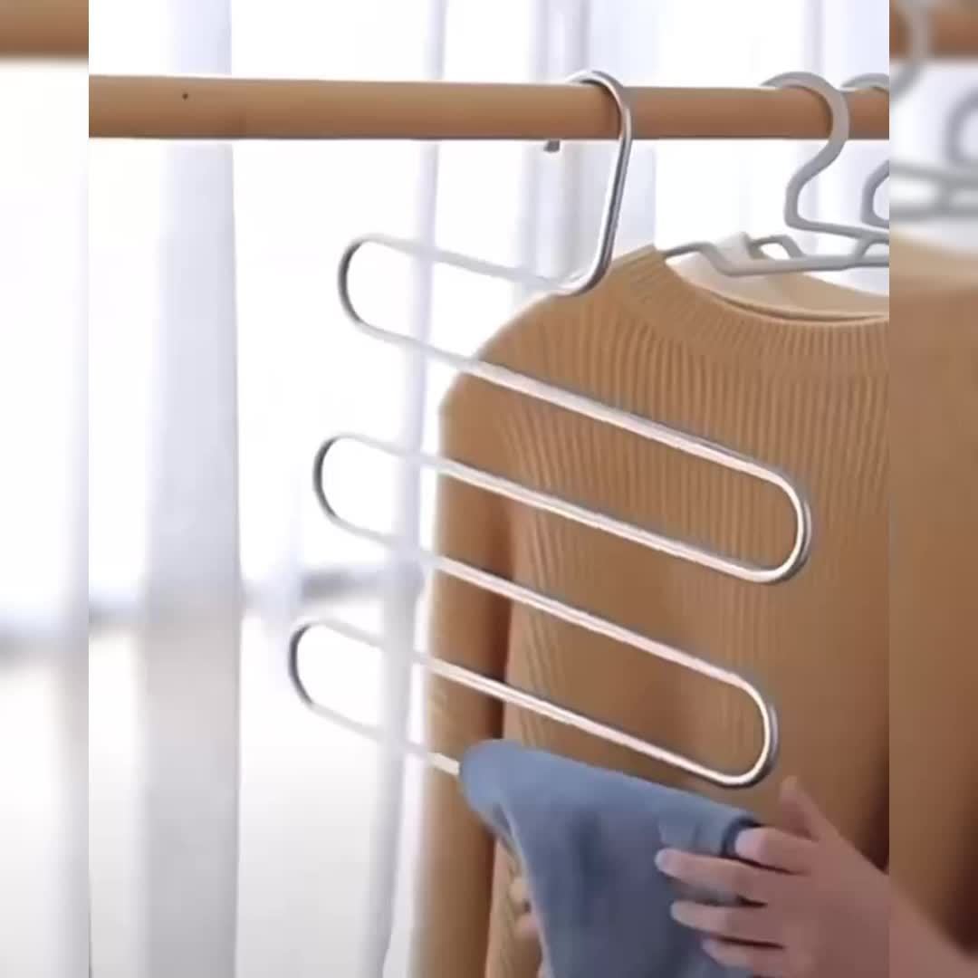 Space-saving stainless steel pants hanger with multiple layers for organizing trousers, towels, and scarves - features non-slip design.